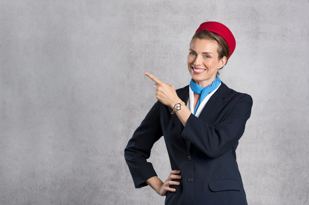 smiling air hostess showing