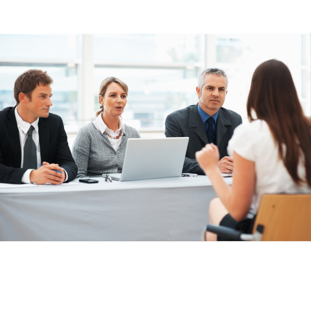 Candidate attending an aviation job interview with a panel of professionals in a corporate setting